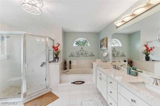 bathroom featuring tile patterned flooring, vanity, and separate shower and tub