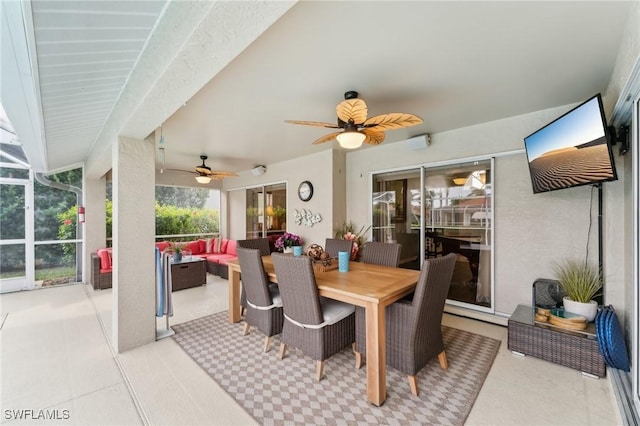 dining space with ceiling fan and light tile patterned floors