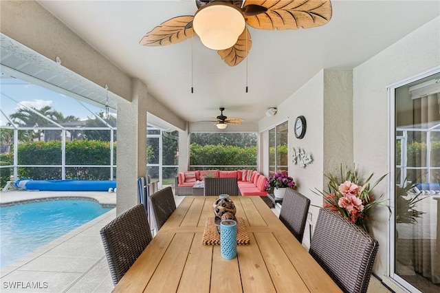 exterior space featuring outdoor lounge area, ceiling fan, and a lanai