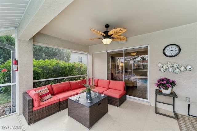 view of patio with ceiling fan and an outdoor living space