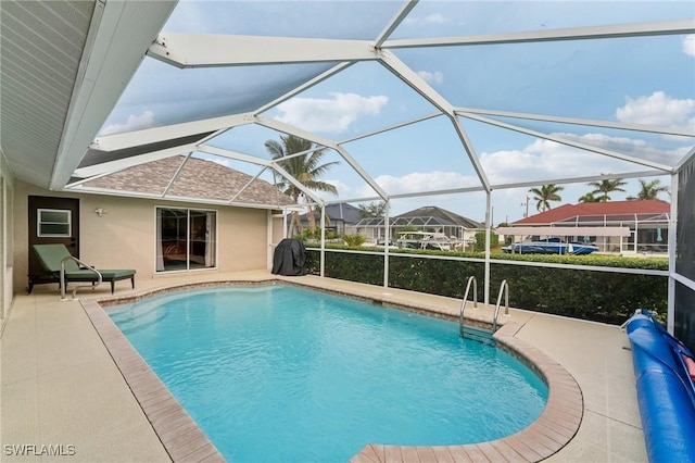 view of pool featuring a lanai and a patio area