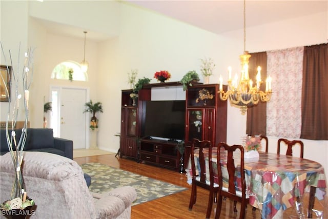 living room featuring a chandelier and hardwood / wood-style flooring