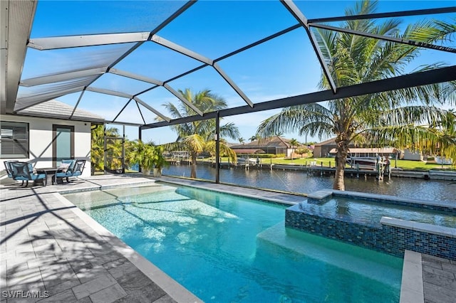 view of pool with a lanai, a patio area, an in ground hot tub, and a water view