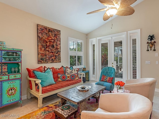 tiled living room with ceiling fan, lofted ceiling, and french doors