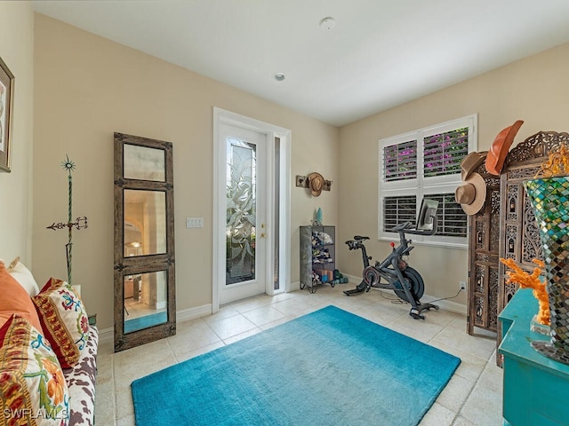 exercise area with light tile patterned floors