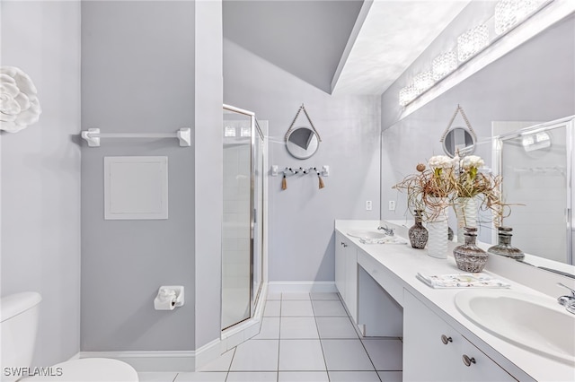 bathroom featuring a shower with shower door, toilet, vanity, and tile patterned flooring