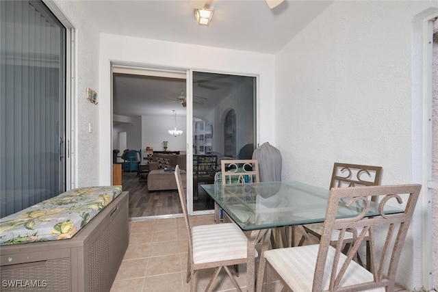 dining room with light tile patterned floors and ceiling fan