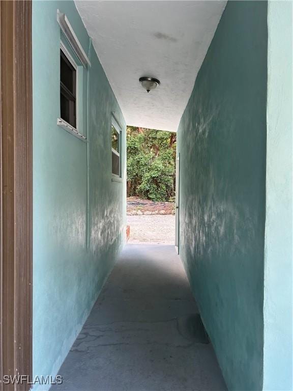 hallway with concrete floors