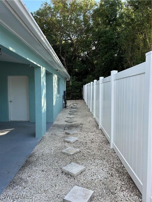 view of side of property with fence