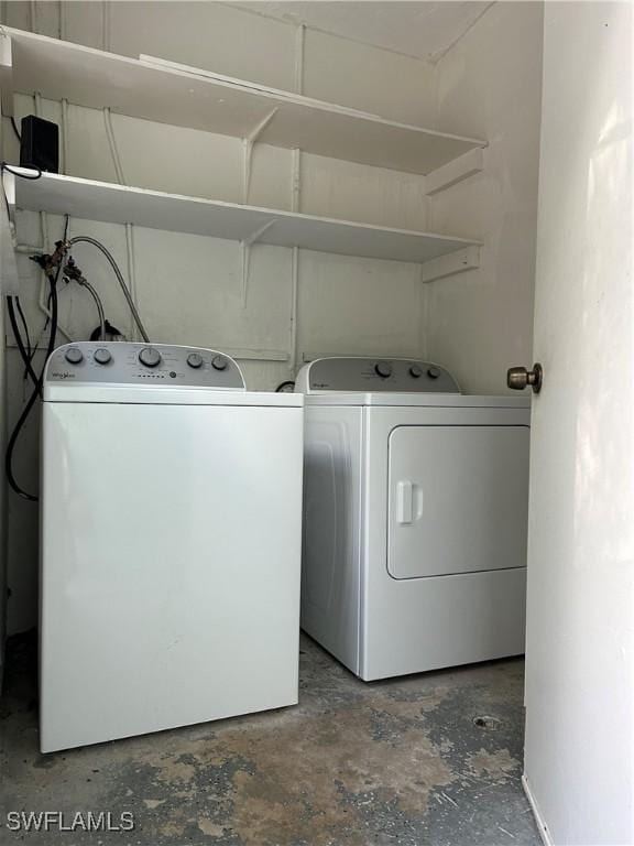 washroom with washer and dryer