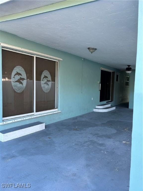 doorway to property with stucco siding