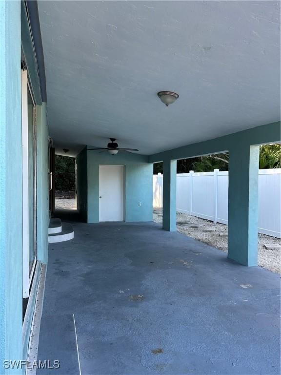 view of patio featuring ceiling fan