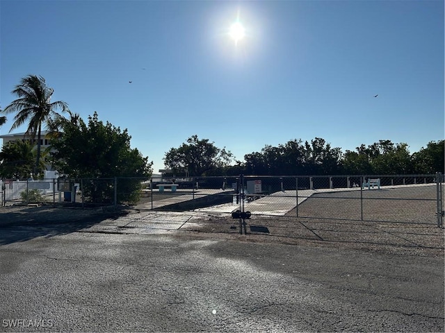 view of road featuring a gate