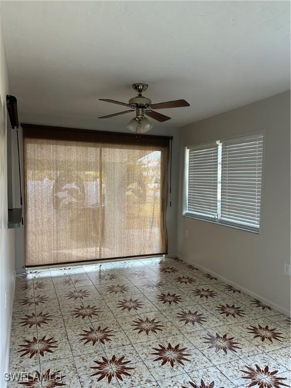 spare room featuring ceiling fan