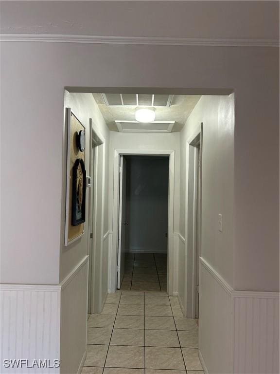 hallway featuring light tile patterned floors