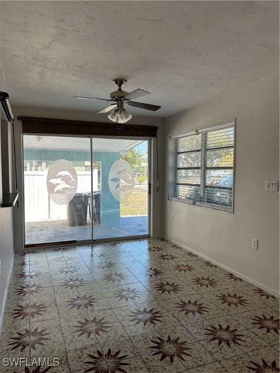 empty room featuring baseboards