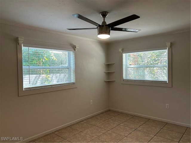 empty room featuring baseboards, light tile patterned flooring, ceiling fan, and crown molding