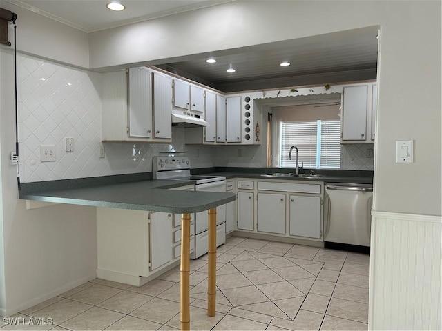 kitchen featuring a sink, range with electric cooktop, under cabinet range hood, dishwasher, and dark countertops