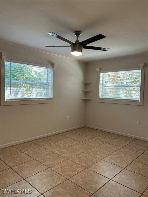 unfurnished room featuring light tile patterned floors, a healthy amount of sunlight, and ceiling fan