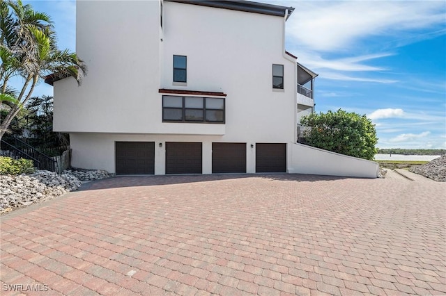 view of side of property with a garage