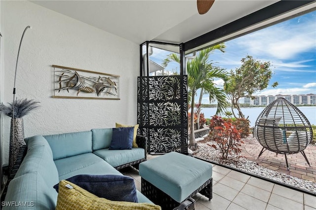 living room with light tile patterned floors and plenty of natural light