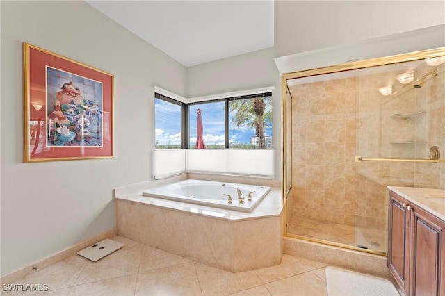 bathroom with independent shower and bath, tile patterned floors, and vanity