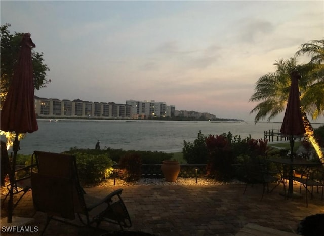 patio terrace at dusk with a water view