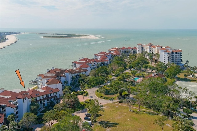 birds eye view of property with a beach view and a water view