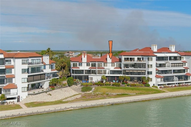 view of building exterior featuring a water view