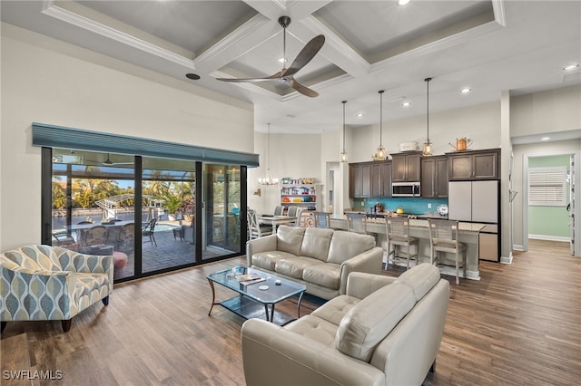 living room with hardwood / wood-style floors, ceiling fan, beamed ceiling, and coffered ceiling