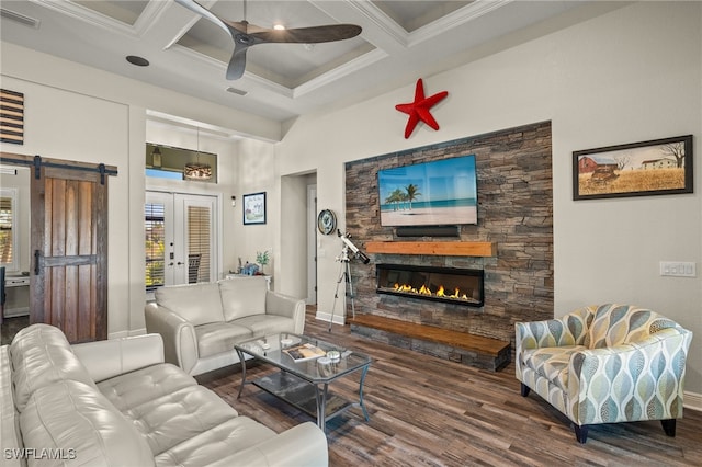 living room with coffered ceiling, crown molding, ceiling fan, beam ceiling, and wood-type flooring