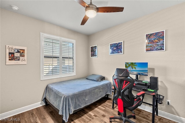 bedroom featuring hardwood / wood-style flooring and ceiling fan