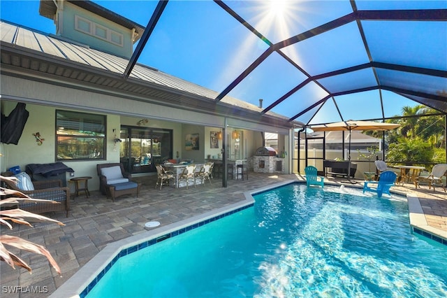 view of pool featuring a lanai and a patio area