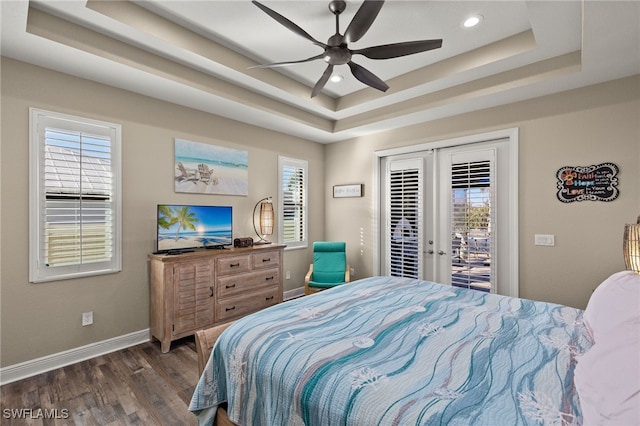 bedroom featuring a raised ceiling, ceiling fan, access to exterior, and french doors