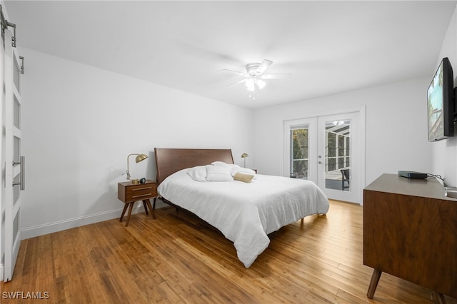 bedroom with ceiling fan, french doors, wood-type flooring, and access to exterior