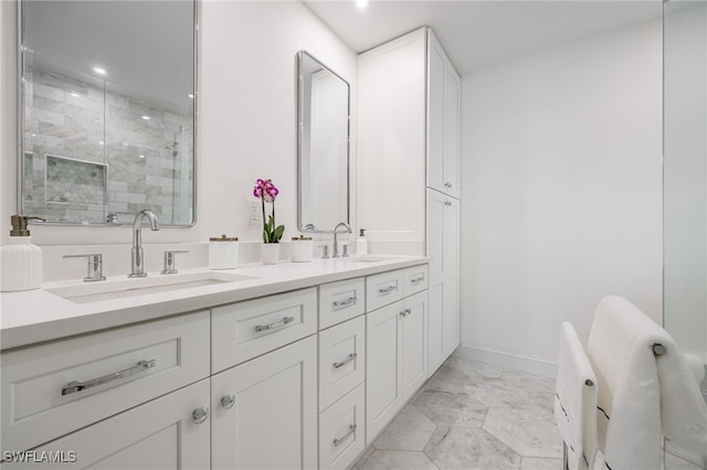 bathroom featuring an enclosed shower and vanity