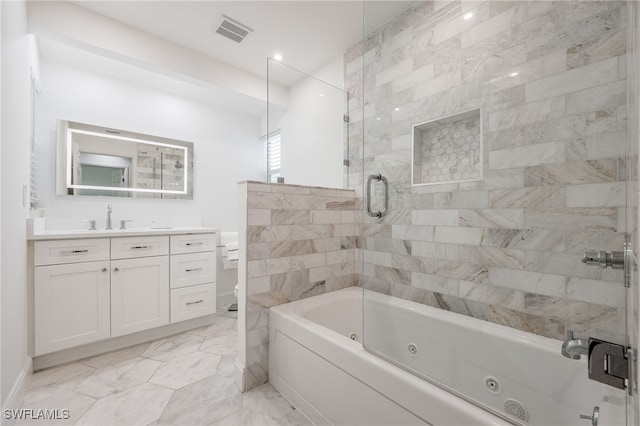 bathroom with vanity and enclosed tub / shower combo