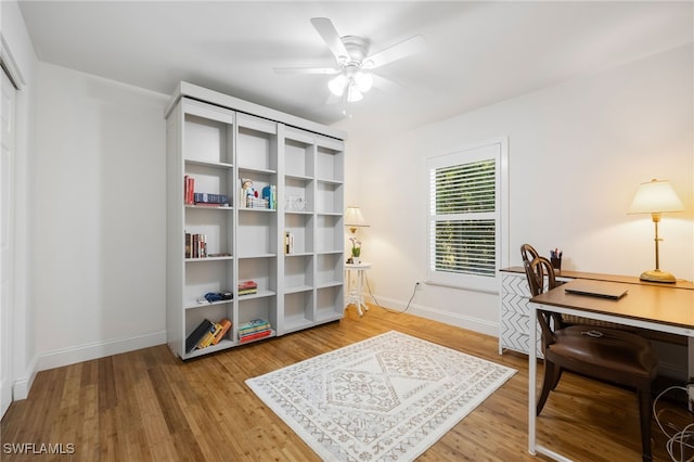 home office featuring ceiling fan and hardwood / wood-style floors