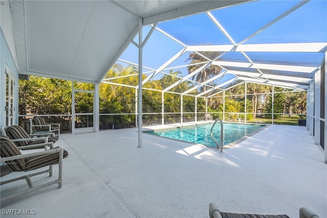 view of pool featuring a lanai and a patio area