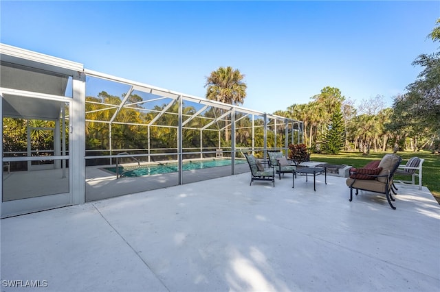 view of patio featuring a lanai