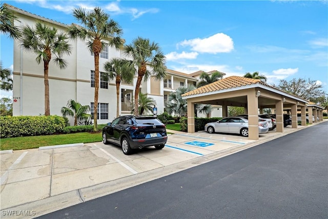 view of partially covered parking lot