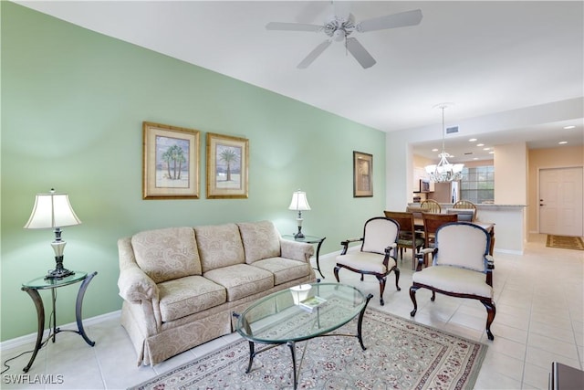 living room featuring light tile patterned floors and ceiling fan with notable chandelier