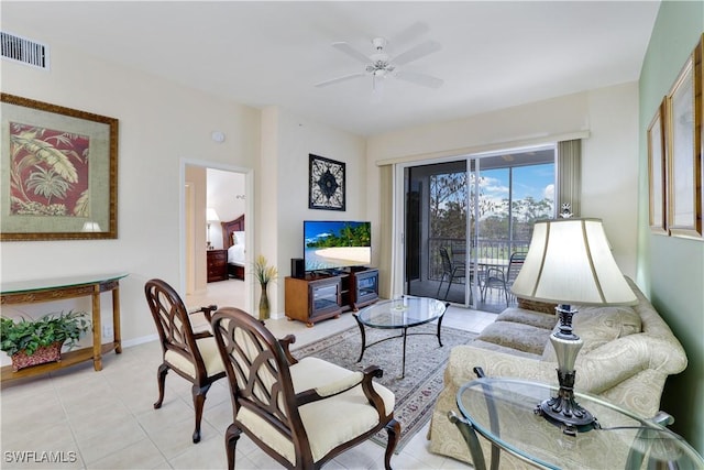 living room featuring ceiling fan and light tile patterned flooring