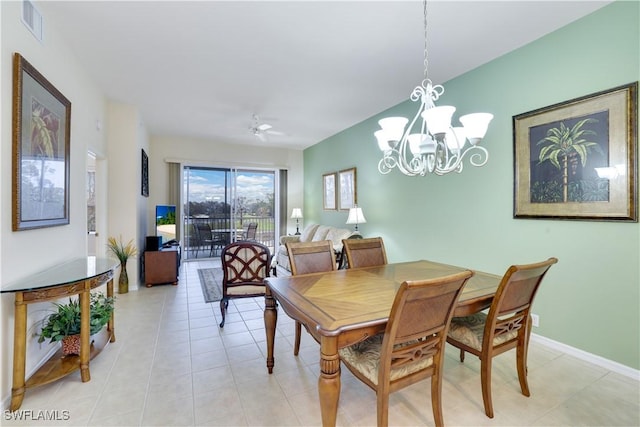 dining space featuring baseboards, visible vents, light tile patterned floors, and a chandelier