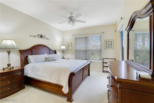 bedroom with baseboards, ceiling fan, and light colored carpet
