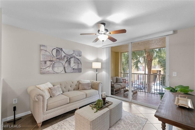 living room featuring ceiling fan and light tile patterned flooring