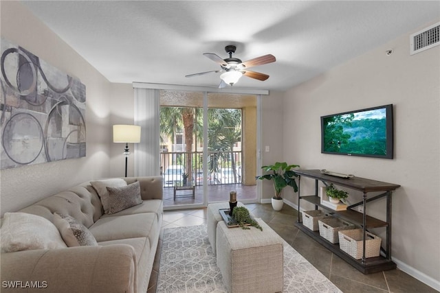 tiled living room with ceiling fan