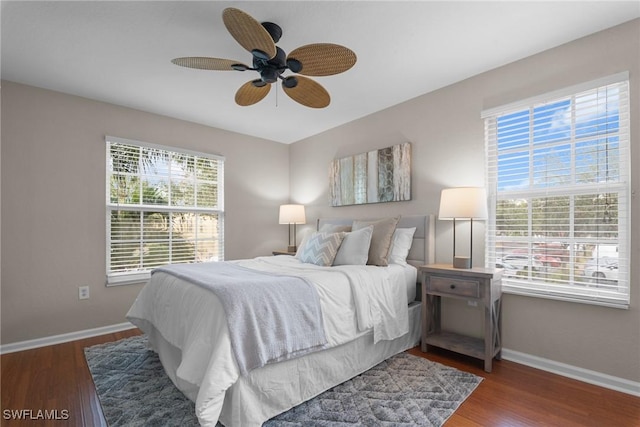 bedroom with ceiling fan and dark hardwood / wood-style floors