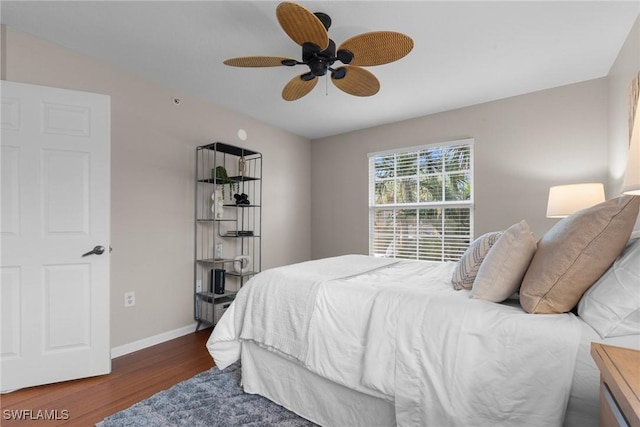 bedroom featuring ceiling fan and dark wood-type flooring