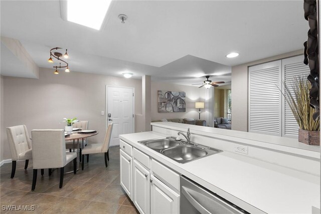 kitchen with white cabinets, ceiling fan, dishwasher, and sink